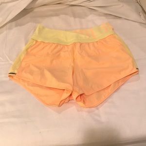 Lululemon yellow and orange running shorts